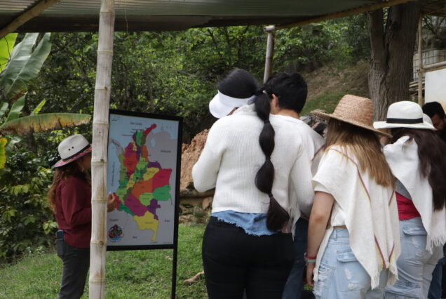 "Local coffee farmer explaining traditional processing during sustainable Coffee Farm Tour"