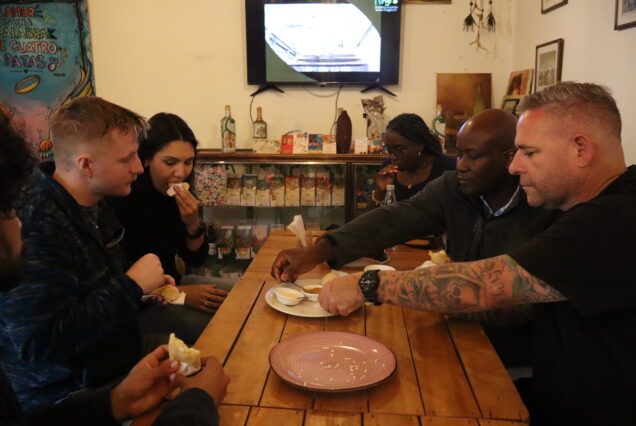 Travelers enjoying a walking food tour through Bogotá’s historic center