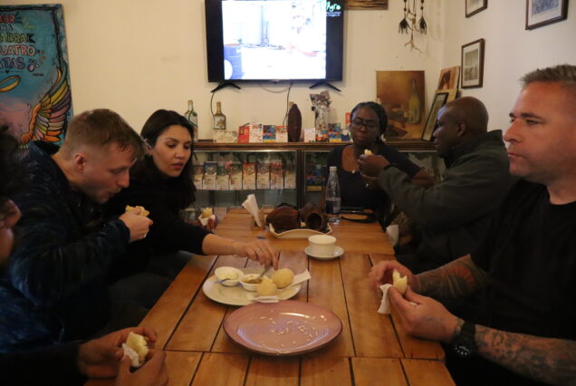 Close-up of regional food tastings arranged on a rustic table