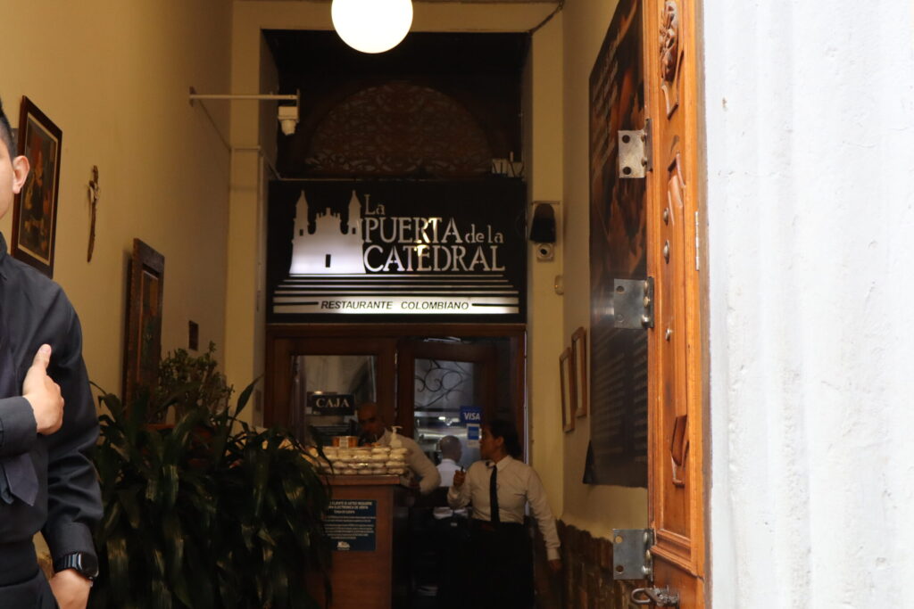 Entrance of a traditional Colombian restaurant in Bogotá’s historic center, welcoming visitors with authentic local flavors La Batalla de las Sopas at the entrance of a traditional Colombian restaurant in Bogotá’s historic center